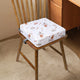Coussin lavable motif espace enfant installé sur une chaise
