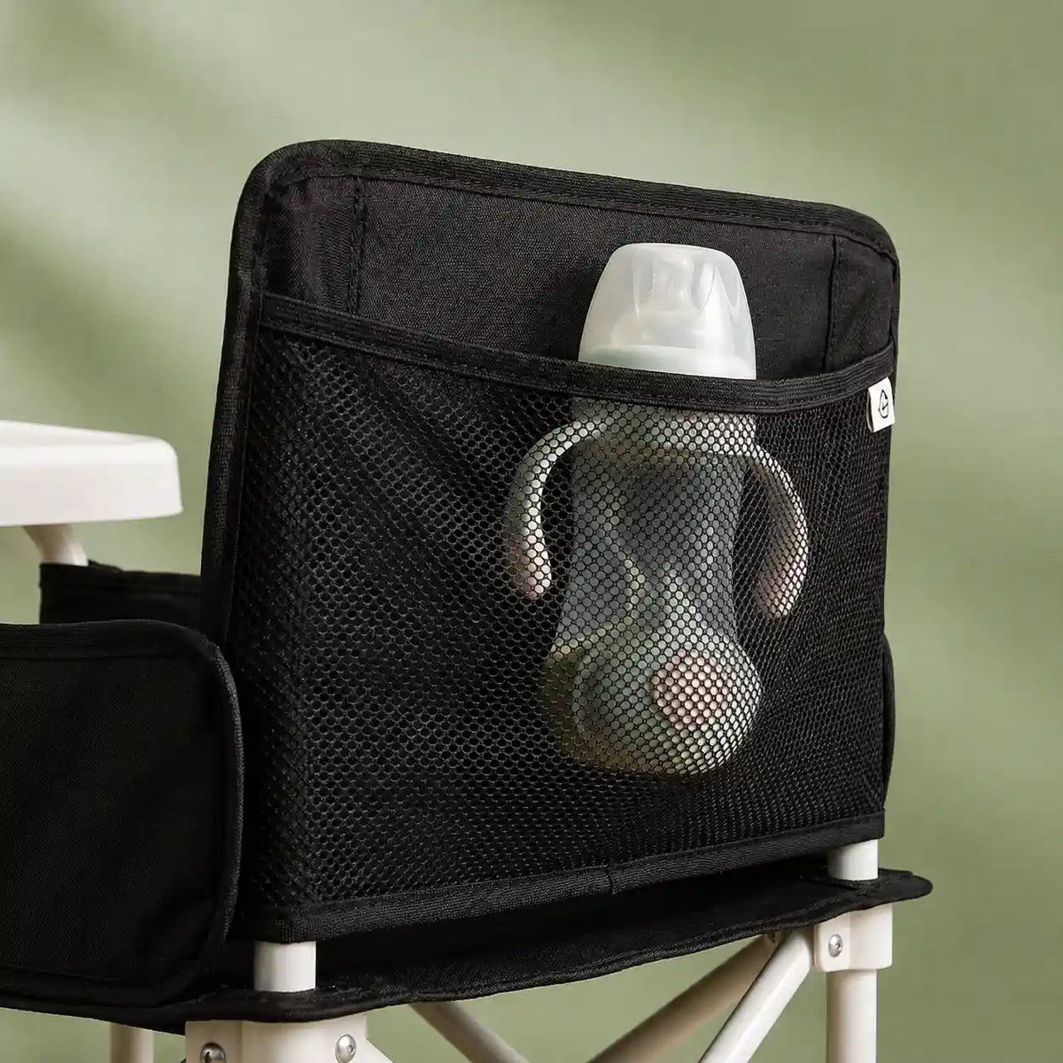 Rehausseur pliable compact noir vue arrière format pliable visible