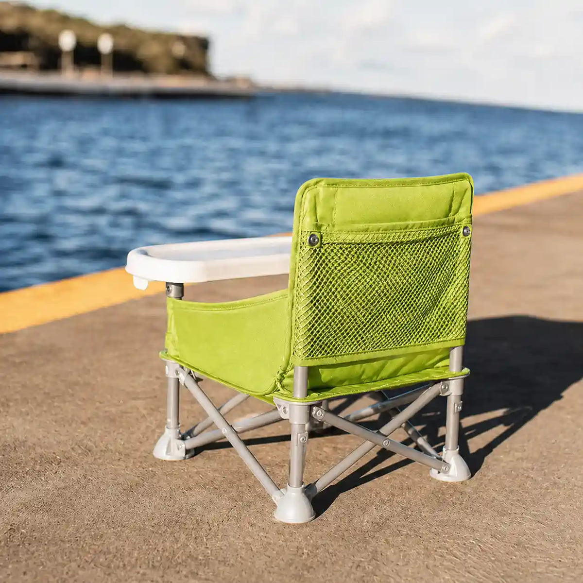 Rehausseur compact pliable vert format pliable visible mise en situation d'usage